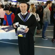 Daniel Stuart receives Medal of Merit